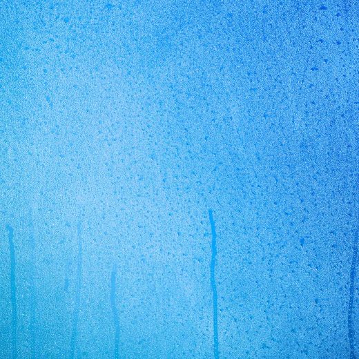 water drops in a blue pool liner